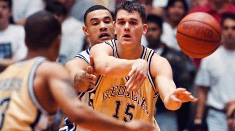 Georgia Tech's Matt Harpring (15) dishes off the ball when he is met by Duke's Trajan Langdon (21) during game action, Sunday, Feb. 2, 1997 at Cameron Indoor Stadium in Durham, N.C. Duke defeated Georgia Tech 70-61. (AP Photo/ Karl DeBlaker)