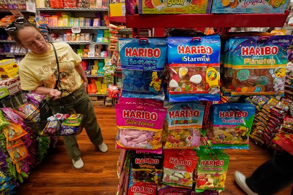 A shopper looks at Haribo candies from Germany, at Economy Candy on New York's Lower East Side, Friday, April 4, 2025. (AP Photo/Richard Drew)