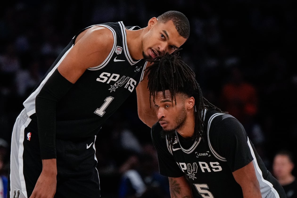 Spurs forward Victor Wembanyama (left) talks with guard Stephon Castle during the second half of Game 3 of the NBA Finals against the Knicks on Monday, June 8, 2026, in New York. (Ross D. Franklin/AP)