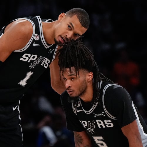 Spurs forward Victor Wembanyama (left) talks with guard Stephon Castle during the second half of Game 3 of the NBA Finals against the Knicks on Monday, June 8, 2026, in New York. (Ross D. Franklin/AP)