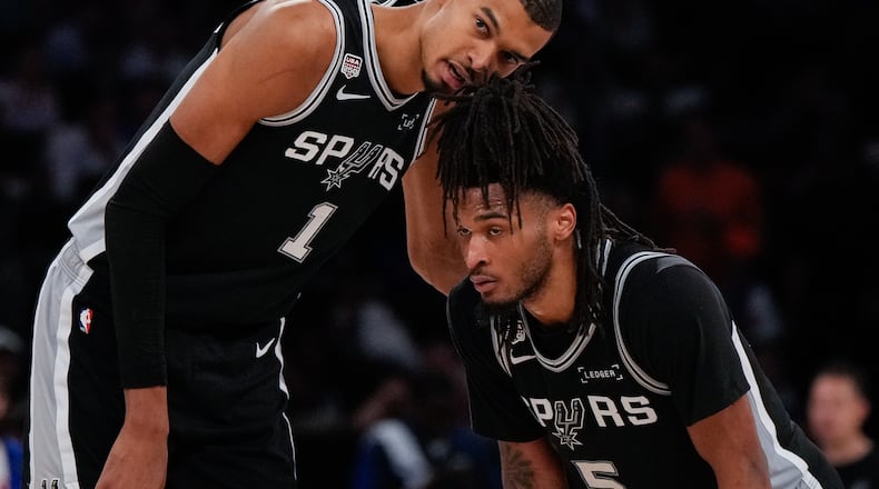 Spurs forward Victor Wembanyama (left) talks with guard Stephon Castle during the second half of Game 3 of the NBA Finals against the Knicks on Monday, June 8, 2026, in New York. (Ross D. Franklin/AP)