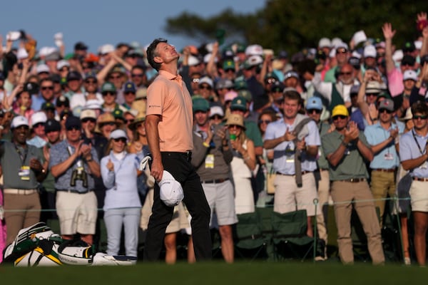 Justin Rose celebrates after a birdie on the 18th hole during the final round at the Masters golf tournament, Sunday, April 13, 2025, in Augusta, Ga. (AP Photo/Matt Slocum)