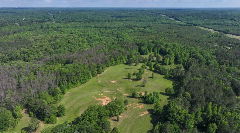 An aerial image from May shows a large wooded area near Newnan, where the $17 billion Project Sail data center complex will be built after the Coweta County Board of Commissioners voted Tuesday to rezone the land to industrial use. (Miguel Martinez/AJC 2025)
