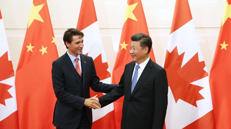 FILE - China's President Xi Jinping, right, shakes hands with Canada's Prime Minister Justin Trudeau before their meeting at the Diaoyutai State Guesthouse in Beijing, China, Wednesday, Aug. 31, 2016. (Wu Hong/Pool Photo via AP, File)