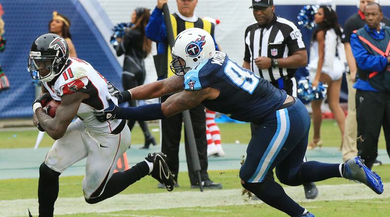 102515 NASHVILLE: — Falcons wide receiver Julio Jones gets past Titans linebacker Derrick Morgan for the game winning touchdown and a 10-7 lead during the third quarter in a football game on Sunday, Oct. 25, 2015, in Nashville. Curtis Compton / ccompton@ajc.com