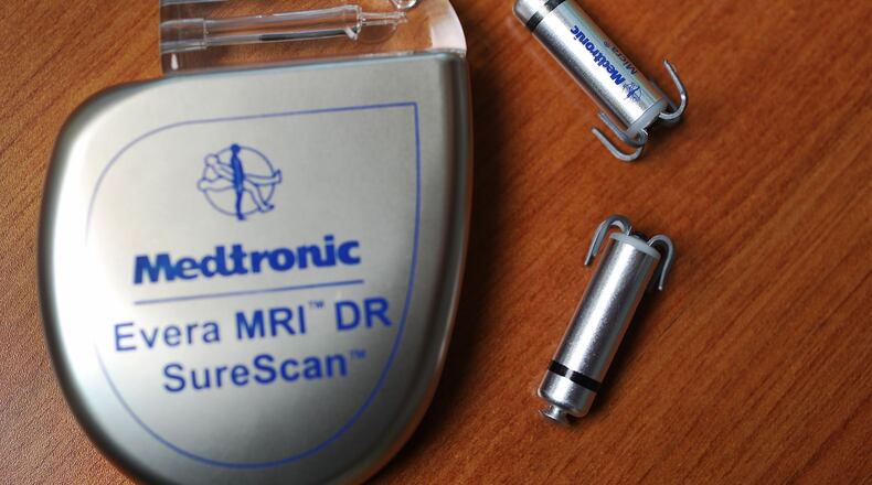 Two of the world's smallest pacemakers, right, next to an original sized pacemaker. An Ohio man is facing arson and fraud charges, after police used data from his pacemaker to gather evidence against him.