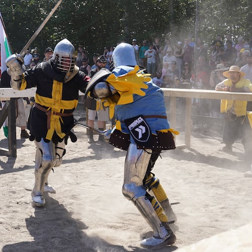 Two fighters battle during the International Medieval Combat Federation's World Championship at Spottrup Castle, in Spottrup, Denmark, Thursday, July 23, 2026. (AP Photo/James Brooks)