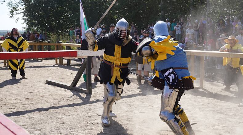 Two fighters battle during the International Medieval Combat Federation's World Championship at Spottrup Castle, in Spottrup, Denmark, Thursday, July 23, 2026. (AP Photo/James Brooks)