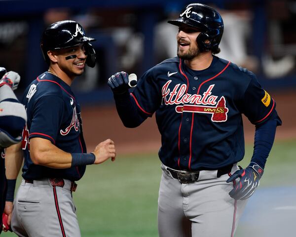 Austin Riley (right) celebrates a Wednesday night home run. (Michael Laughlin/AP)