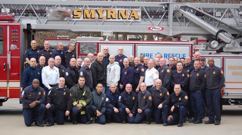 Smyrna firefighter shaved their heads in support of a colleague battling cancer.