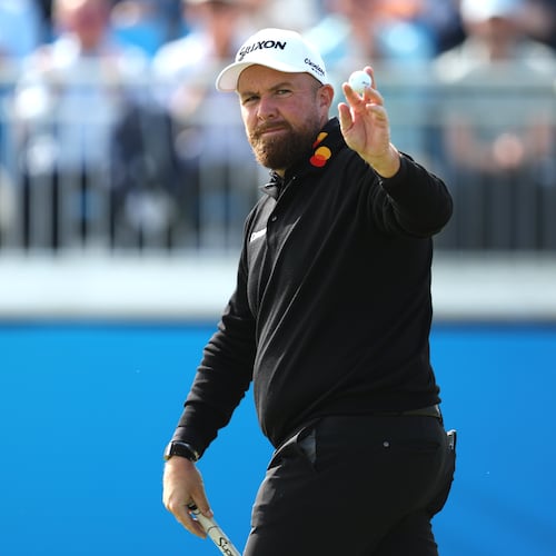 Shane Lowry, of Ireland, acknowledges the gallery after putting on the 18th green during the second round of of the Irish Open golf tournament in Doonbeg, Ireland, Friday Sept. 11, 2026. (Brian Lawless/PA via AP)