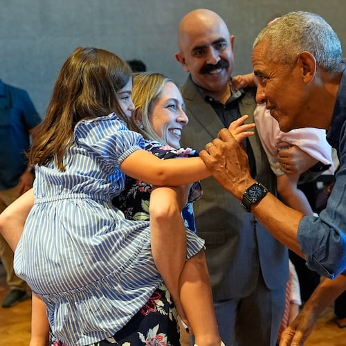 Former President Barack Obama greets the first group of visitors at the official opening of the Obama Presidential Center in Chicago, Friday, June 19, 2026. (AP Photo/Pablo Martinez Monsivais, Pool)