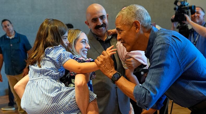 Former President Barack Obama greets the first group of visitors at the official opening of the Obama Presidential Center in Chicago, Friday, June 19, 2026. (AP Photo/Pablo Martinez Monsivais, Pool)