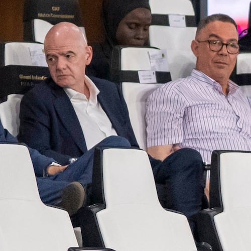 FIFA president Gianni Infantino, center, speaks to FIFA secretary general Mattias Grafstrom, left, sitting beside president of Moroccan Royal Football Federation Fouzi Lekjaa as they attend a Women's AFCON 2026 soccer match between Malawi and Zambia, in Rabat, Morocco, Wednesday, Aug. 5, 2026. (AP Photo)