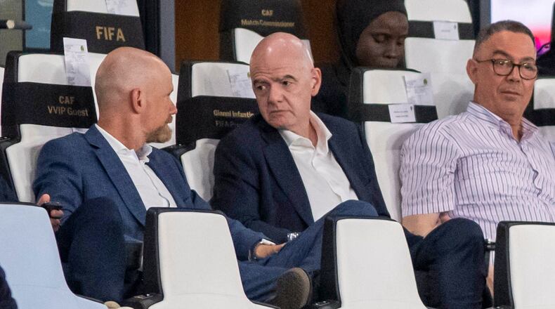 FIFA president Gianni Infantino, center, speaks to FIFA secretary general Mattias Grafstrom, left, sitting beside president of Moroccan Royal Football Federation Fouzi Lekjaa as they attend a Women's AFCON 2026 soccer match between Malawi and Zambia, in Rabat, Morocco, Wednesday, Aug. 5, 2026. (AP Photo)