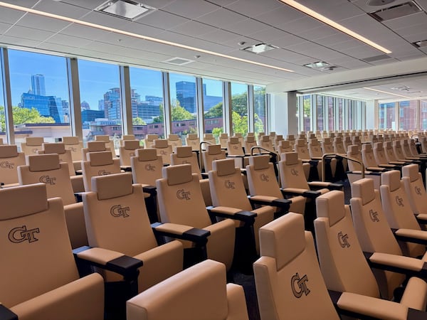 Georgia Tech's football meeting room has seating for 178 and looks out onto Midtown Atlanta's skyline, an element designed to remind team members and show recruits the business opportunities available to Tech graduates. The room can be split into two rooms for offense and defense. (Ken Sugiura/AJC)