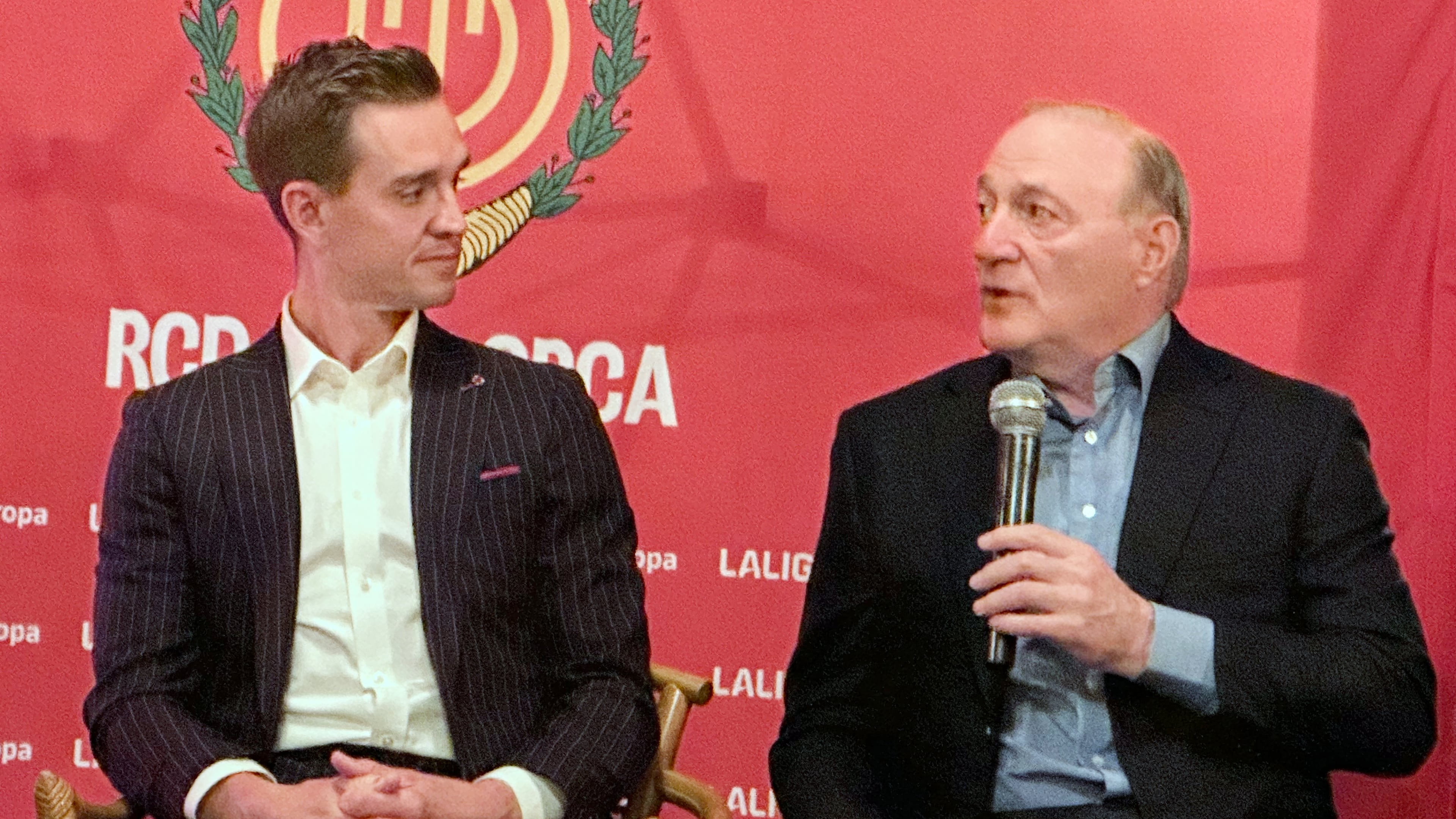 Mallorca controlling owner Andy Kohlberg, right, and former U.S. soccer national team star Stuart Holden, left, a Mallorca co-owner, speak Tuesday, Oct. 14, 2025, at Maxwell Social in New York to promote the club’s marketing efforts in the United States. (AP Photo/Ronald Blum)