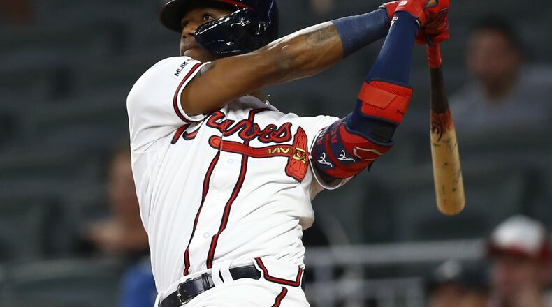 The Braves’ Ronald Acuna hits a solo home run in the eighth inning Thursday night against the Mets at SunTrust Park.a