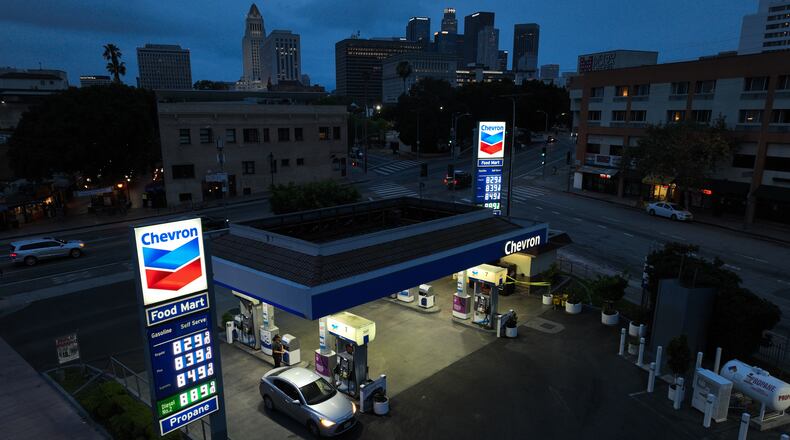 Gas prices are displayed at a Chevron gas station, in downtown Los Angeles, Tuesday, March 31, 2026. (AP Photo/Jae C. Hong)