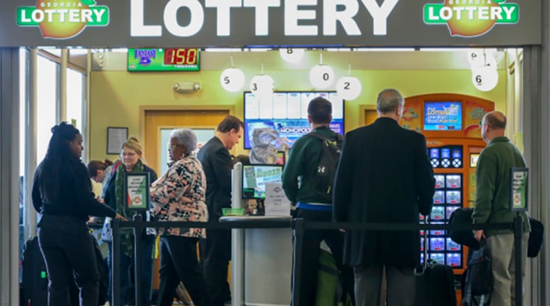 SECONDARY PHOTO - January 12, 2016 Hartsfield-Jackson International Airport : Lines formed outside at the Georgia Lottery Airport South Kiosk at Hartsfield-Jackson International Airport on Tuesday,  Jan. 12, 2016 as the record-breaking Powerball jackpot continued to climb, hitting $1.5 billion ahead of Wednesdays' drawing, according to the Georgia Lottery. Players who would take the cash option would win $930 million, before taxes. Winning isn't everything, though, and players should expect a barrage of con artists, lawsuit filers and taxes when they win. Remember, though, even if Wednesday's drawing fails to declare a winner, the children are the real winners. Since Powerball began rolling over on Nov. 7, the jackpot has generated an estimated $26.9 million for Georgia Lottery-funded Pre-K and HOPE Scholarships. Players have had until 10 p.m. Wednesday to buy $2 tickets, according to lottery officials. The drawing was held at 11 p.m. EST. and the result not available at the time of this report. JOHN SPINK /JSPINK@AJC.COM