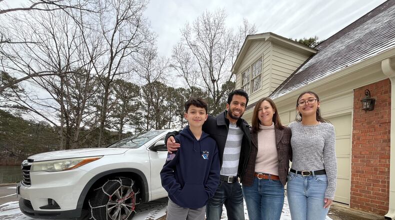 The Laboy family (pictured) welcomed a stranger, Evline Simmons, into their Snellville home Tuesday night after she became stranded by the icy roads.