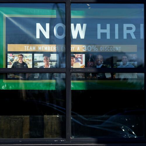 FILE - A hiring sign is displayed at a grocery store in Northbrook, Ill., Tuesday, Jan. 21, 2025. (AP Photo/Nam Y. Huh)