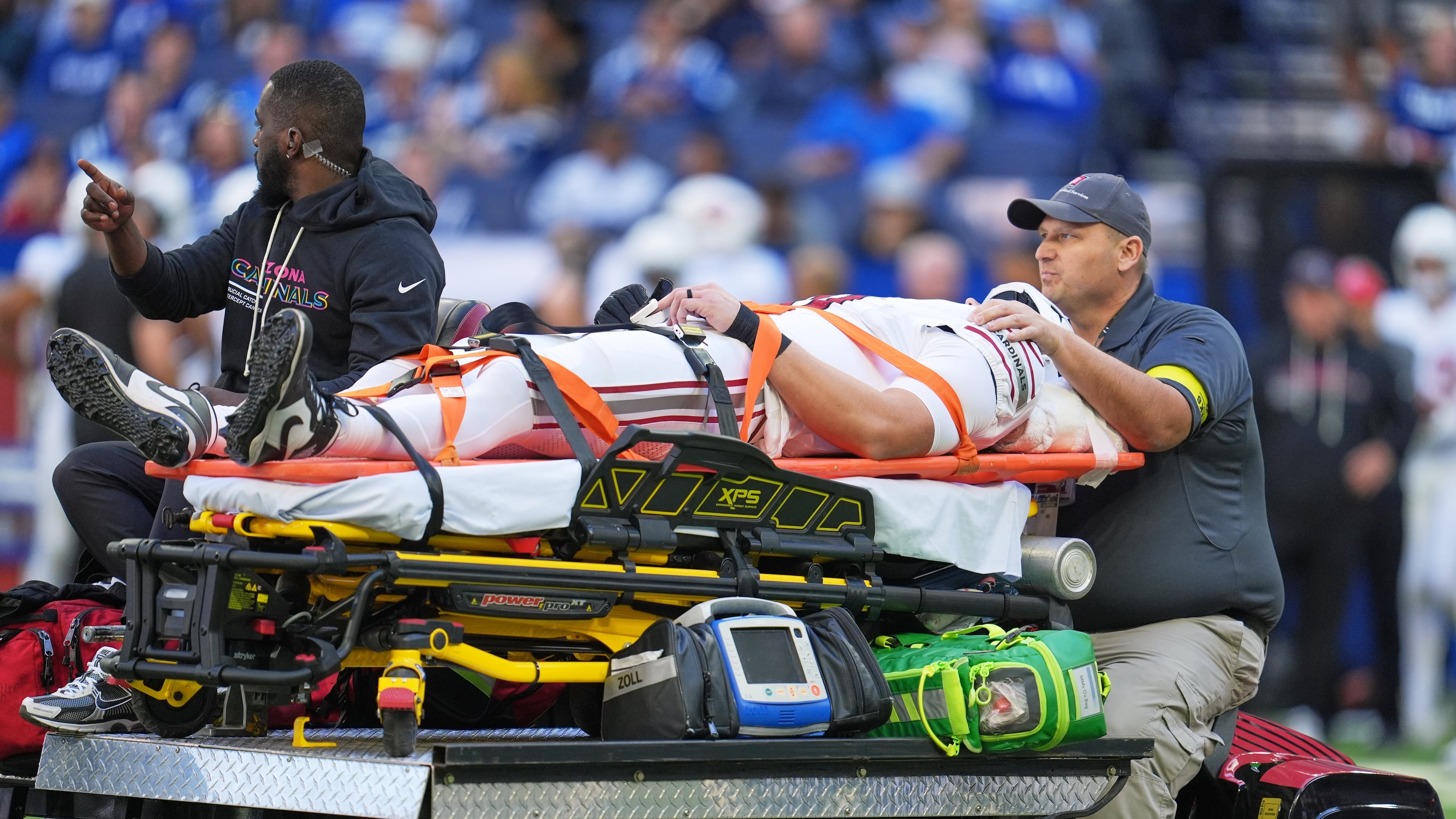 Arizona Cardinals' Travis Vokolek is taken off the field on a cart during the first half of an NFL football game against the Indianapolis Colts Sunday, Oct. 12, 2025, in Indianapolis. (AP Photo/Michael Conroy)