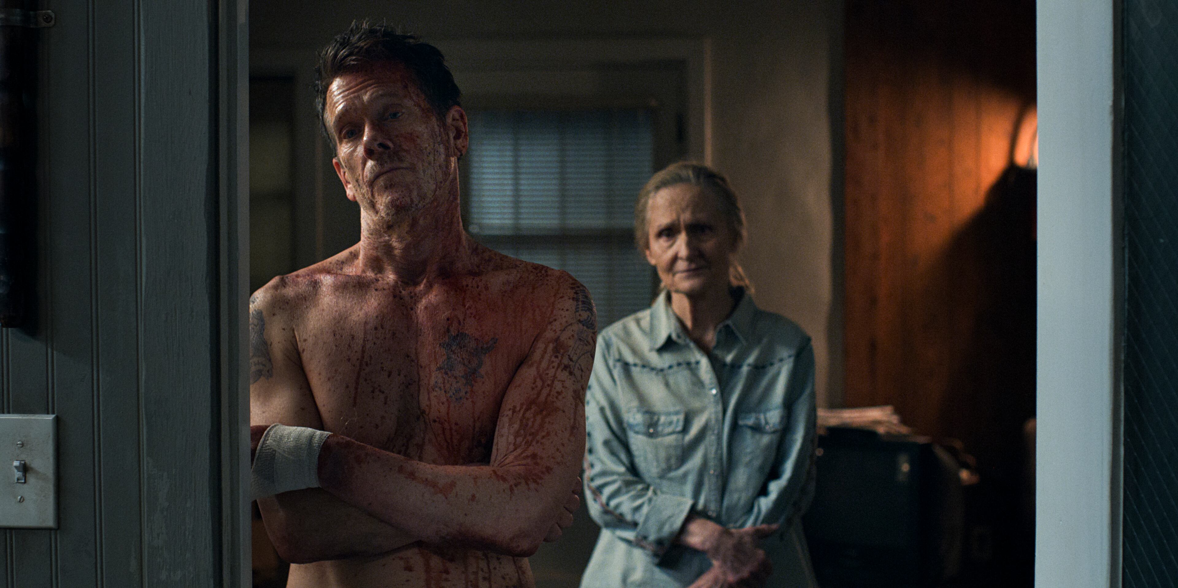 Kevin Bacon with Beth Grant in the new Amazon series "The Bondsman," a genre mashup featuring family drama, demon hunting and comedy. AMAZON