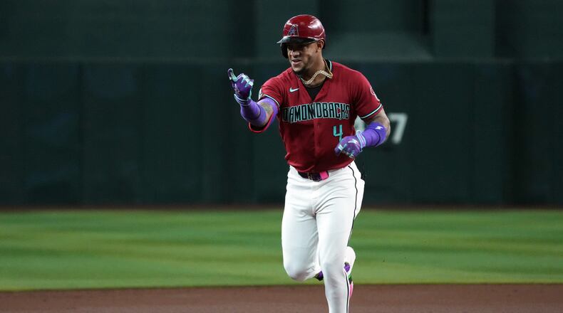 Arizona Diamondbacks' Ketel Marte reacts after hitting a solo home run against the Colorado Rockies in the first inning of a baseball game, Tuesday, Aug. 11, 2026, in Phoenix. (AP Photo/Rick Scuteri)