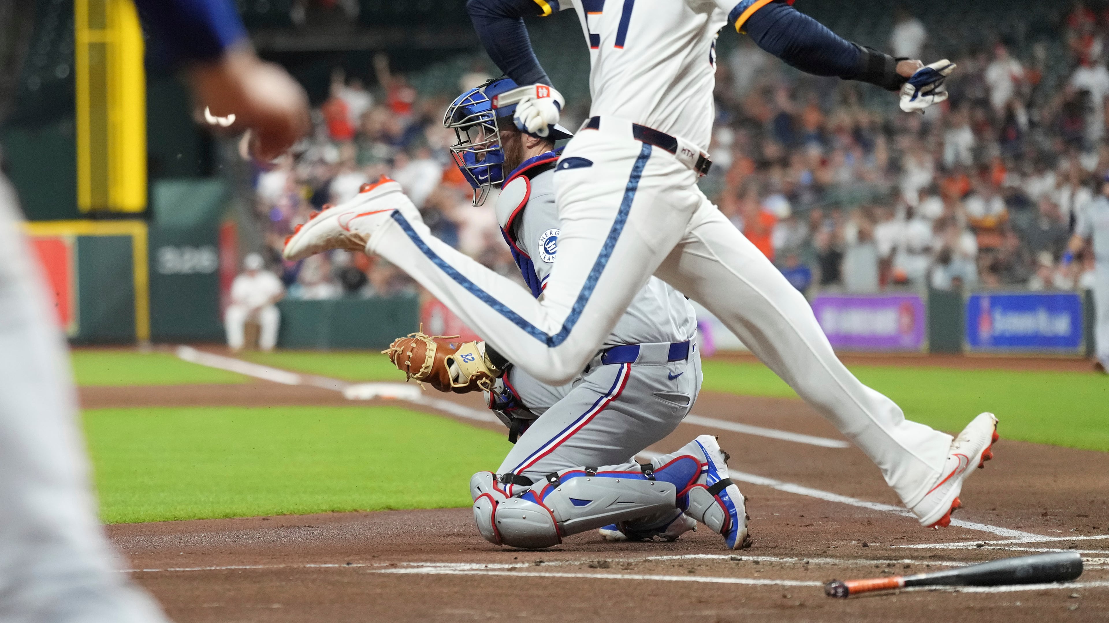 Houston Astros' Yordan Alvarez, front right, scores on an RBI single hit by Carlos Correa against the Texas Rangers during the first inning of a baseball game Monday, Sept. 15, 2025, in Houston. (AP Photo/Karen Warren)
