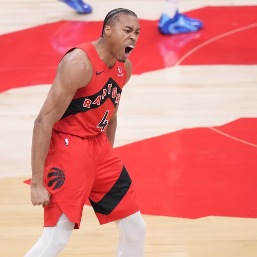 Toronto Raptors forward Scottie Barnes (4) reacts after making a basket as Cleveland Cavaliers guard James Harden (1) looks on during the first half of Game 4 in a first-round NBA basketball playoffs series in Toronto, Sunday, April 26, 2026. (Nathan Denette/The Canadian Press via AP)