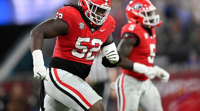 FILE - Georgia defensive lineman Christen Miller (52) heads to the sideline after a play against Florida during the second half of an NCAA college football game Saturday, Nov. 2, 2024, in Jacksonville, Fla. (AP Photo/Phelan M. Ebenhack, File)