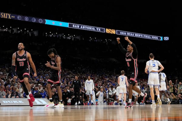 Houston forward J'Wan Roberts, left, celebrates after their Winn against the Duke in the national semifinals at the Final Four of the NCAA college basketball tournament, Saturday, April 5, 2025, in San Antonio. (AP Photo/Brynn Anderson)