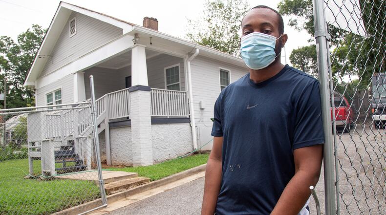 Terboris Barnes stands in front of his James P. Brawley Dr. home on August 14, 2020. Barnes's home does not qualify for lead remediation because officials found his levels are 4 points below the cutoff levels. STEVE SCHAEFER FOR THE ATLANTA JOURNAL-CONSTITUTION
