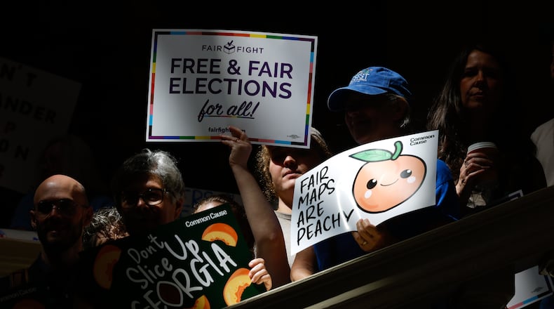 Activists opposed to redistricting, including Martha Jean Schindler, gather at a press conference before the state legislature convenes for a special session in Atlanta on June 17, 2026. Georgia Republican leaders later announced that they wouldn’t redraw the state’s political maps during the session. (Arvin Temkar/AJC)