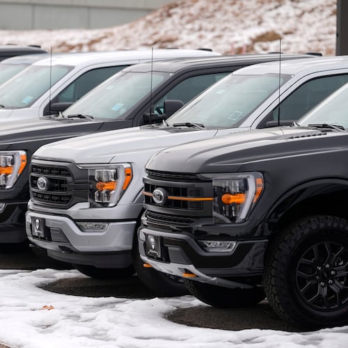 FILE - Unsold 2024 F150 pickup trucks sit in a long row at a Ford dealership Sunday, Jan. 21, 2024, in Broomfield, Colo. (AP Photo/David Zalubowski, File)