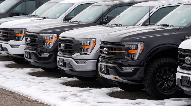FILE - Unsold 2024 F150 pickup trucks sit in a long row at a Ford dealership Sunday, Jan. 21, 2024, in Broomfield, Colo. (AP Photo/David Zalubowski, File)