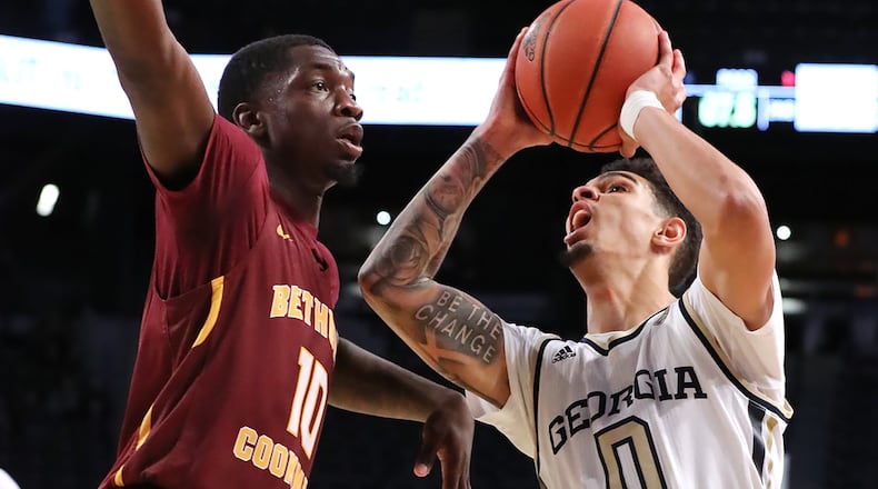 Tech guard Michael Devoe draws a foul for the three point play shooting over Bethune-Cookman defender Cletrell Pope in the final seconds for a 68-65 victory Sunday, Dec. 1, 2019, at McCamish Pavilion in Atlanta.