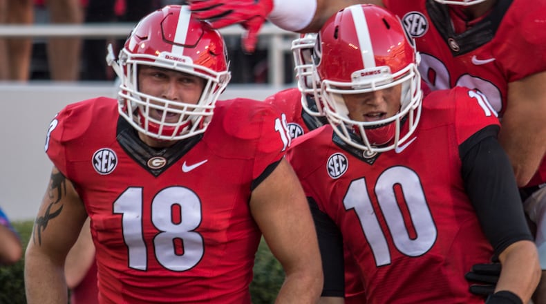 Georgia quarterback Jacob Eason (10) and Georgia tight end Isaac Nauta (18) celebrate as the Bulldogs face Tennessee Saturday, Oct. 1, 2016, at Sanford Stadium in Athens.
