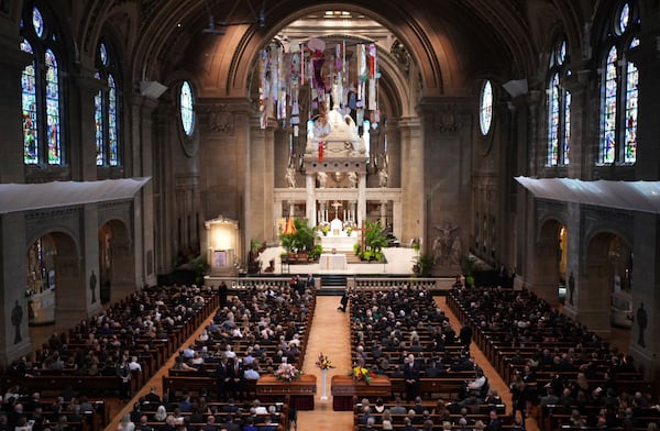 Attendees take their seats before funeral services for Mark and Melissa Hortman at the Basilica of St. Mary in Minneapolis, Minn., on Saturday, June 28, 2025. (Jeff Wheeler/Star Tribune via AP, Pool)