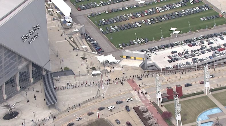 Huge lines outside Mercedes-Benz Stadium in downtown Atlanta on 1st day of mass vaccination site