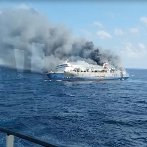 In this photo made from video released by the Indonesian National Search and Rescue Agency (BASARNAS) on Sunday, Aug. 2, 2026, smoke billows from passenger ship Mutiara Santosa 2 after it caught fire in the waters off Madura Island, Indonesia. (BASARNAS via AP)