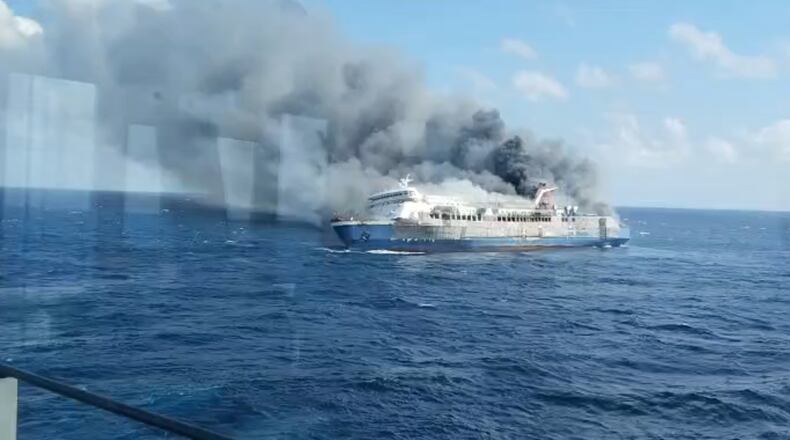 In this photo made from video released by the Indonesian National Search and Rescue Agency (BASARNAS) on Sunday, Aug. 2, 2026, smoke billows from passenger ship Mutiara Santosa 2 after it caught fire in the waters off Madura Island, Indonesia. (BASARNAS via AP)