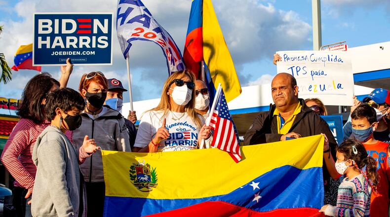 Biden supporter Adelys Ferro speaks to the media as Venezulan-Americans celebrate the approval of temporary protection status for more than 300,000 Venezuelan citizens living in the United States, at El Arepazo in Doral, Florida, on Tuesday, March 9, 2021. (Daniel A. Varela/Miami Herald/TN)S