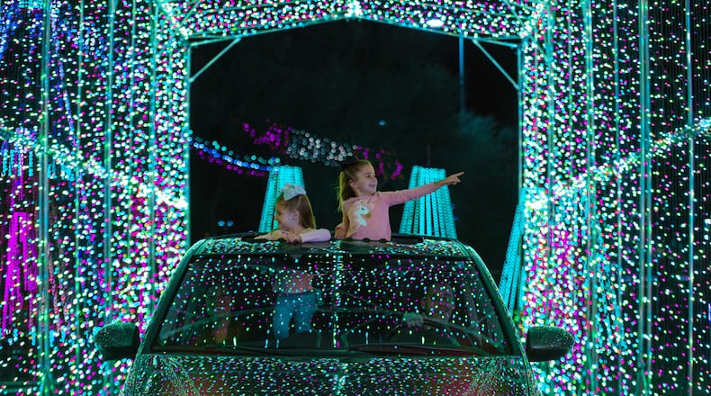 Youngsters are thrilled by the light show at the World of Illumination’s Reindeer Road. 
(Courtesy of World of Illumination’s Reindeer Road)