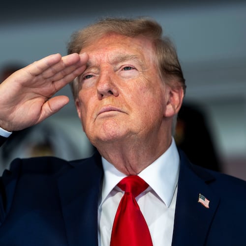 President Donald Trump is pictured during the playing of the national anthem at the IndyCar Freedom 250 Grand Prix auto race, Sunday, Aug. 23, 2026, in Washington. (Doug Mills/The New York Times via AP, Pool)