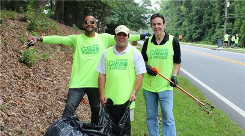 From left Chad Livsey, Joe Wilson and Snellville Mayor Pro Tem Dave Emanuel during a Snellville Clean and Proud work day on Oak Road. (Courtesy City of Snellville)