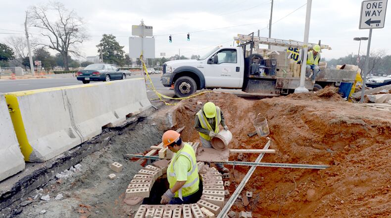 Who delivers services — like road maintenance — and how taxpayers should pay for them is among the issues the cities of Cherokee County want to hammer out in public negotiations with the county. AJC FILE