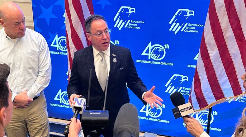Republican Jewish Coalition CEO Matt Brooks, center, alongside Ari Fleischer, an RJC board member and press secretary to former President George W. Bush, answers questions from members of the news media about confronting antisemitism within the Republican Party, during the coalition's annual conference at the Venetian Resort in Las Vegas, Saturday, Nov. 1, 2025. (AP/Thomas Beaumont)
