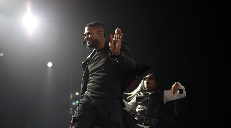 Dec. 9, 2014 - ATLANTA: Usher displays his famous moves for his opening set of his UR Experience tour in Atlanta performing at the Philips Arena. The UR Experience is the precursor to the release of his eighth studio album entitled UR. Dance favorite "Good Kisser"was released as the lead single off the album. (Akili-Casundria Ramsess/Special to the AJC) Usher brought his smooth moves to Philips Arena last month for a hometown show. Photo: Akili-Casundria Ramsess/Special to the AJC.